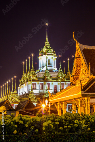 Night scene of Loha Prasat at Wat Ratchanaddaram Woravihara-buddhist temple located in Phra Nakhon district,Bangkok,Thailand. Also called the 'Metal Castle'.
