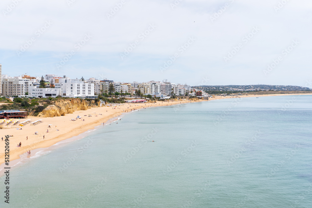 Armacao de Pera Algarve Portugal. Beautiful view on Atlantic ocean at day time and city Armacao de Pera Algarve Portugal. Beautiful view on Atlantic ocean at day time and city