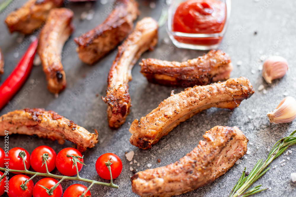 grilled pork ribs on a stone background grilled pork ribs on a stone background