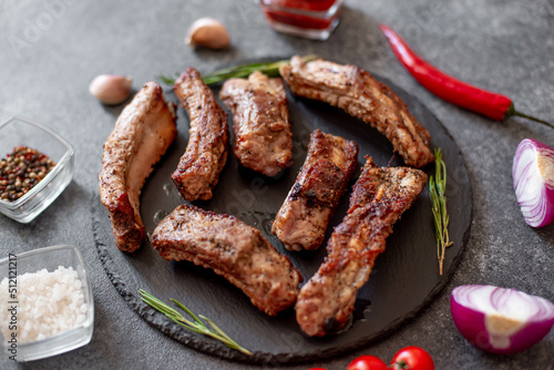 grilled pork ribs on a stone background