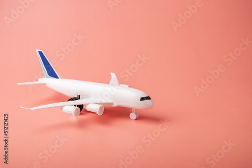 Wallpaper Mural cargo transportation, air communication, charter flights, holidays and vacations, plane and on a pink background, copy space Torontodigital.ca