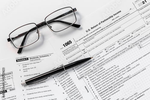Pen on US individual tax form. Tax payment season
