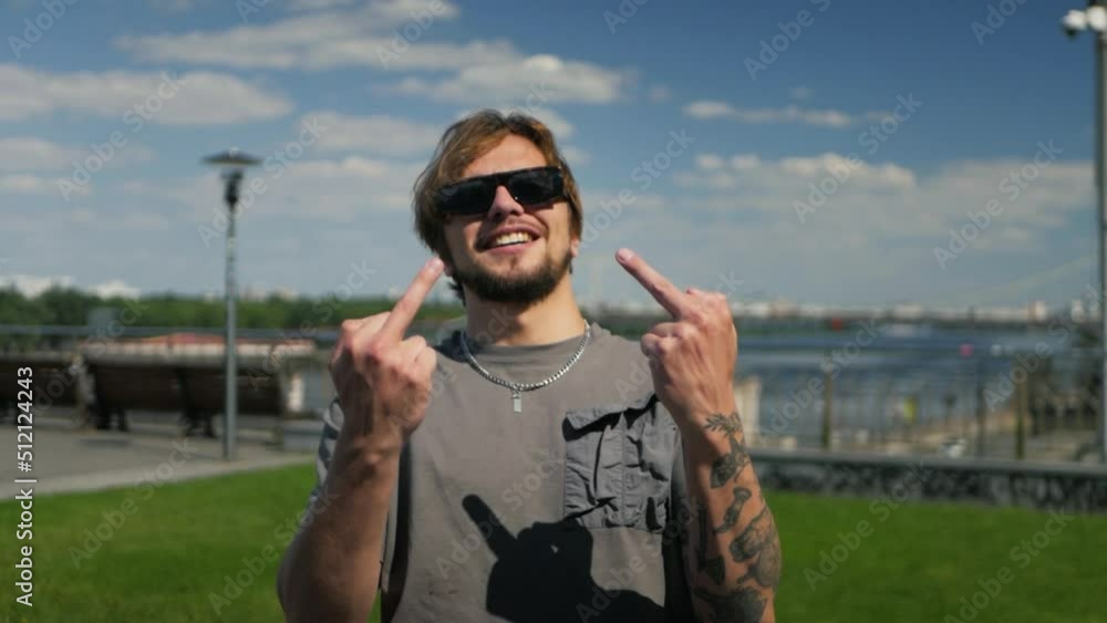 Middle Man Hand Off Stylish caucasian man with tattoed arms showing middle finger on both ...