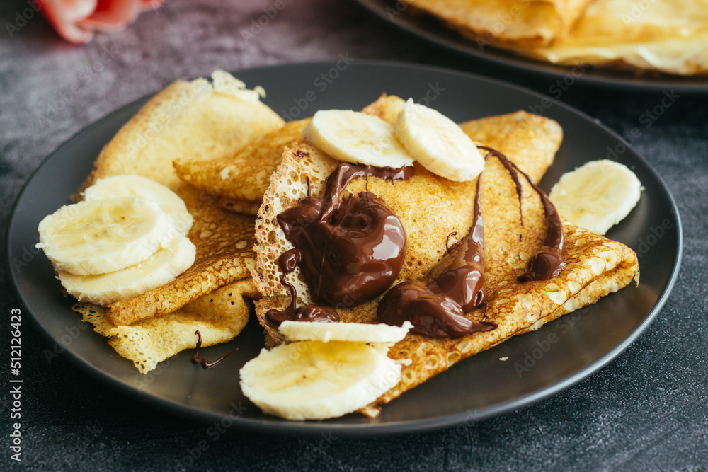Delicious pancakes on a plate. Pancakes with chocolate Delicious pancakes on a plate. Pancakes with chocolate