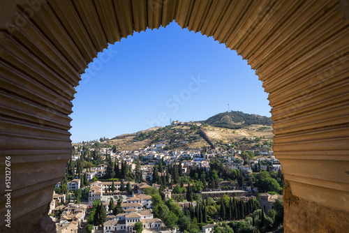 The Albayzin district of Granada viewed from a window in the Alhambra palace in summer, Andalusia, Spain photo