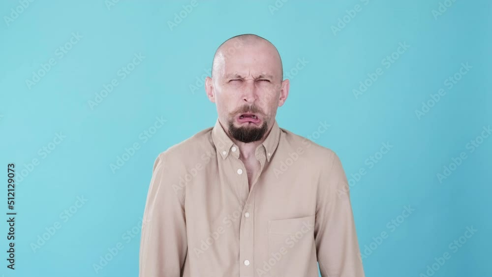 Whining man. Failure disappointment. Regret feeling. Boomerang animation. Sad upset funny loser guy crying gif loop isolated on blue copy space background. Whining man. Failure disappointment. Regret feeling. Boomerang animation. Sad upset funny loser guy crying gif loop isolated on blue copy space background.