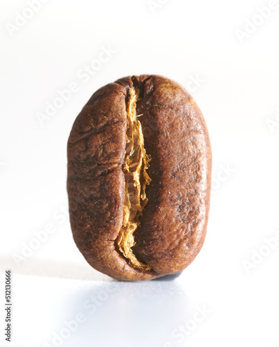 Roasted coffee beans isolated close up on white background, clipping path