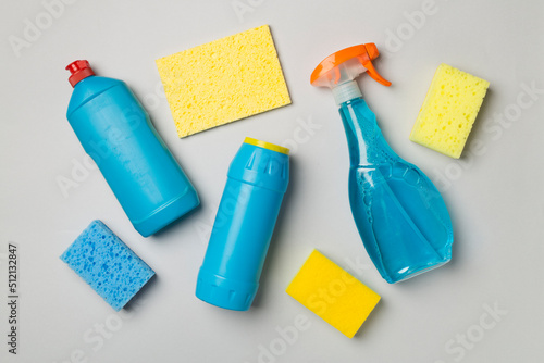 Many different house cleaning products on color background, top view photo