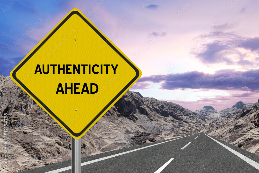 Yellow highway sign with the word Authenticity and a metaphoric road leading to future success.