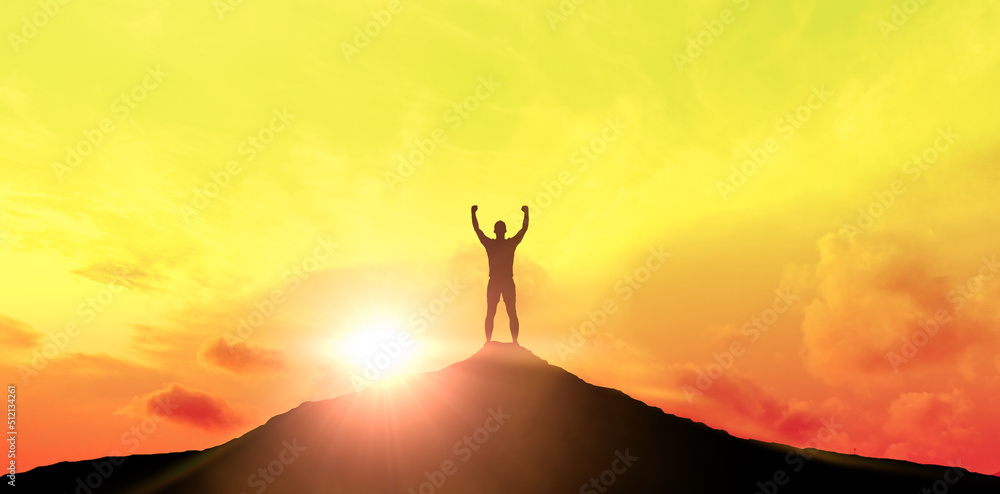 Silhouette of businessman on top of mountain at sunset or dawn. Concept of aim and objective achievement.
