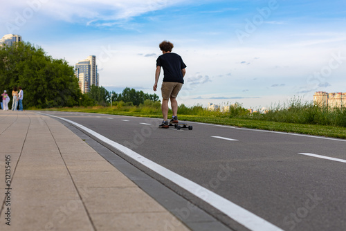  the guy rides a skateboard along an track