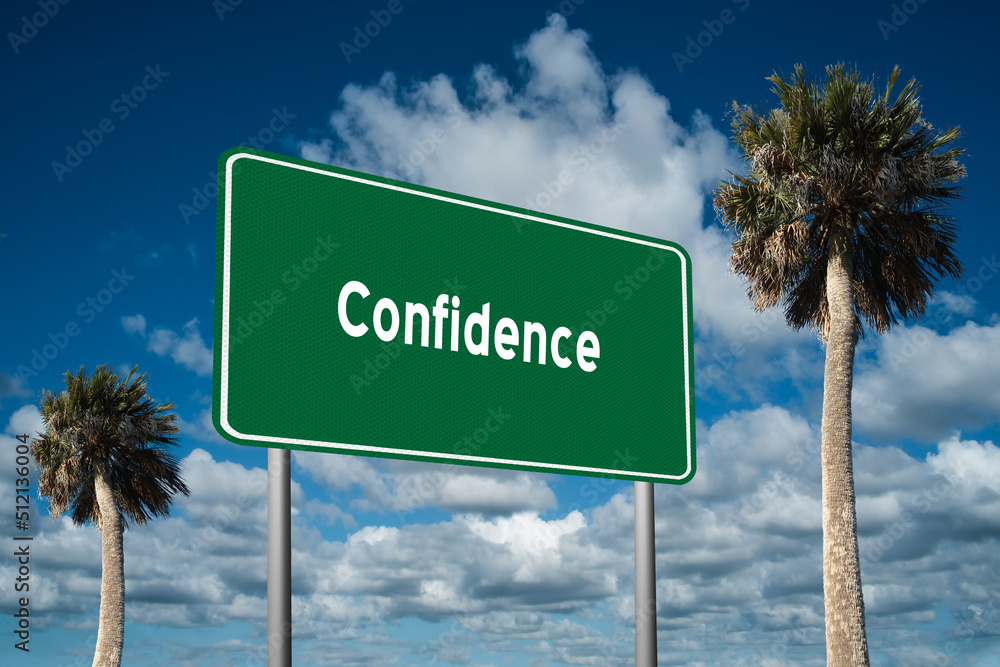 Fototapeta premium Highway sign with the word Confidence on a beautiful blue sky background with palm trees. Motivational concept for finding what we want on the journey of life.