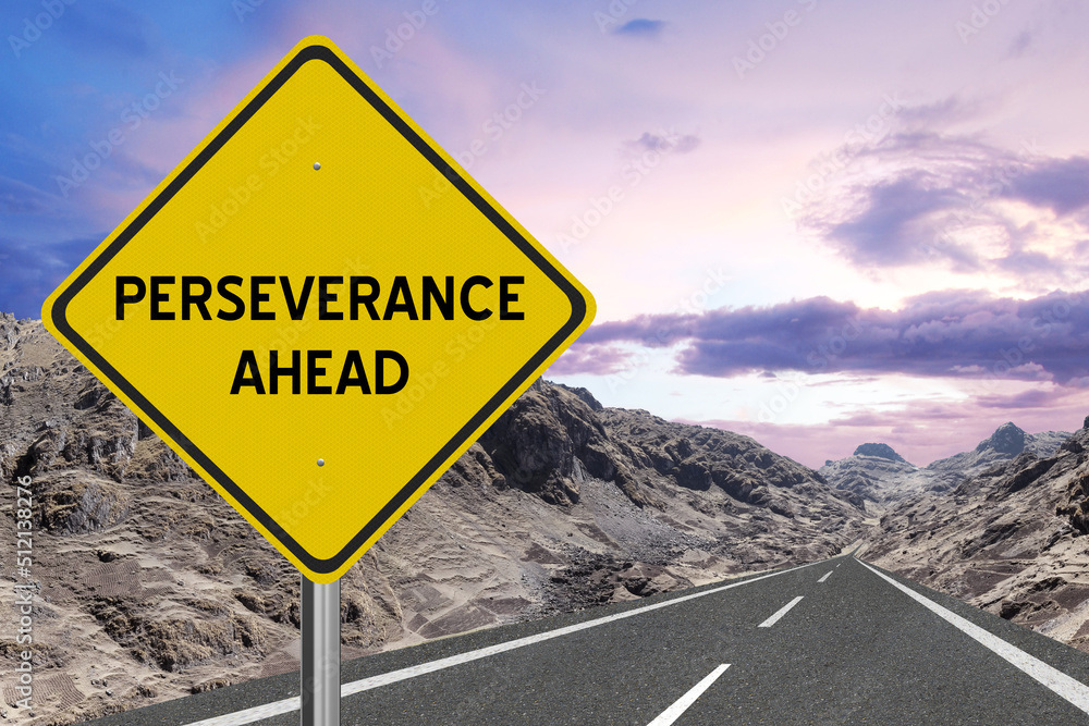 Yellow highway sign with the word Perseverance and a metaphoric road leading to future success.