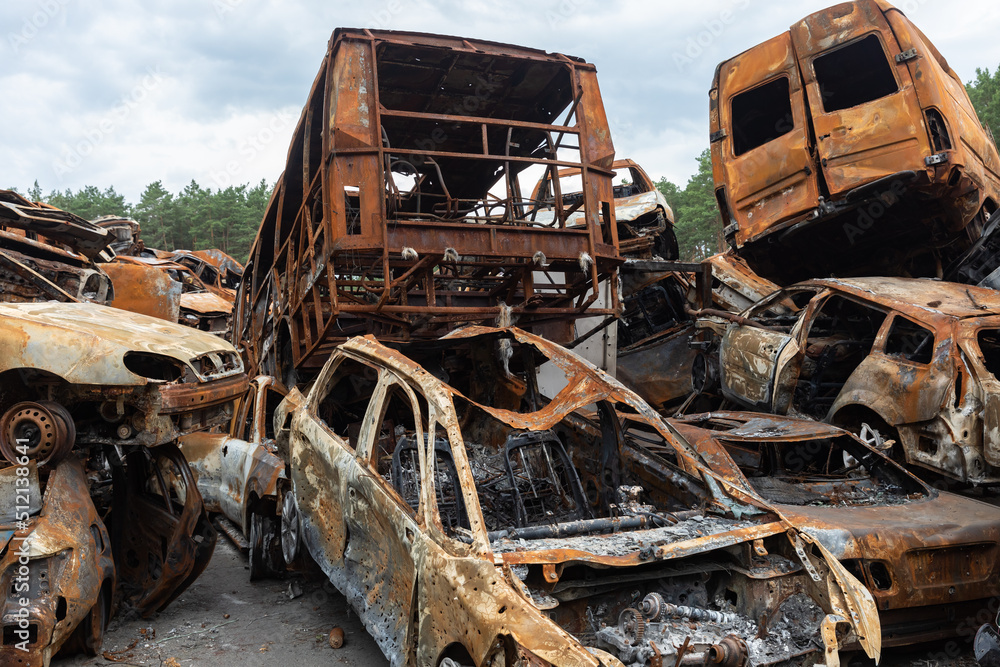 War in Ukraine. Car graveyard in Irpin. Shot cars of civilians. War in Ukraine. Car graveyard in Irpin. Shot cars of civilians.