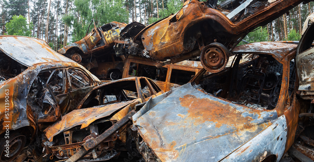 War in Ukraine. Car graveyard in Irpin. Shot cars of civilians. War in Ukraine. Car graveyard in Irpin. Shot cars of civilians.