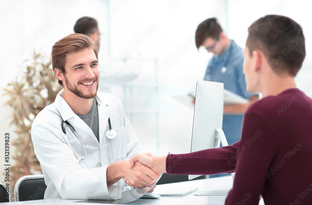 handshake between doctor and patient handshake between doctor and patient