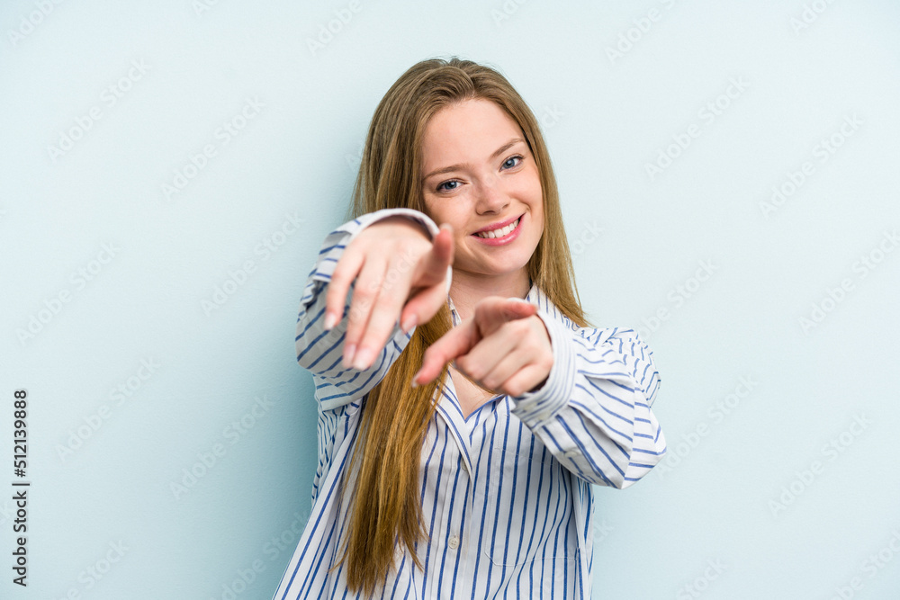 Young caucasian woman isolated on blue background pointing to front with fingers. Young caucasian woman isolated on blue background pointing to front with fingers.