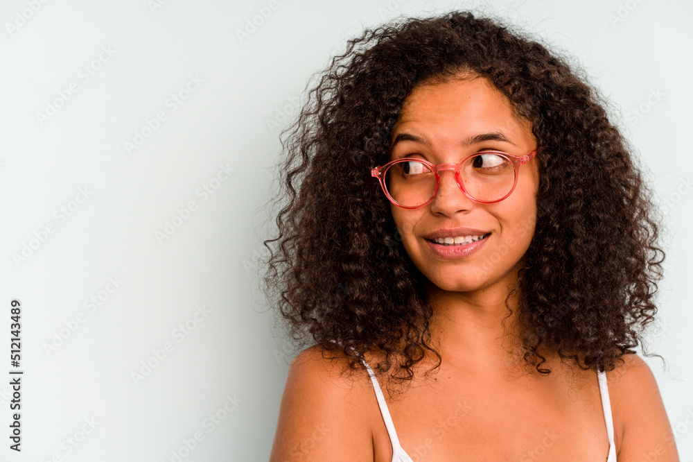 Young Brazilian woman isolated on blue background Young Brazilian woman isolated on blue background