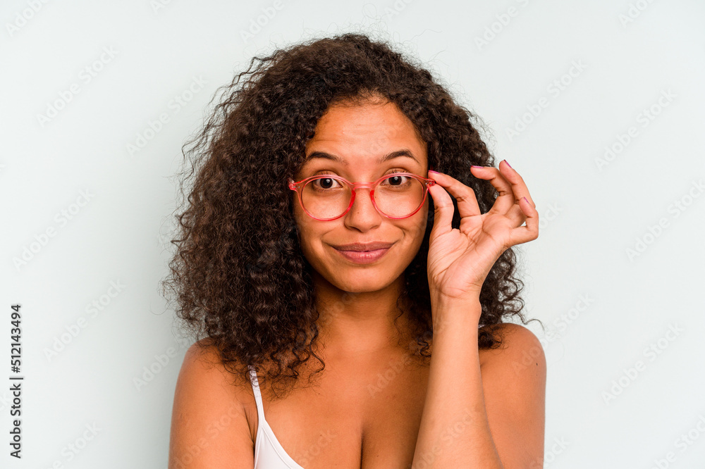 Young Brazilian woman isolated on blue background Young Brazilian woman isolated on blue background