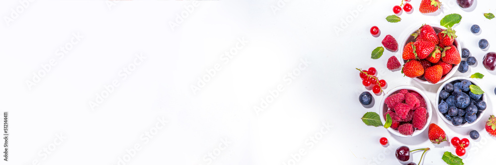 Summer vitamin food concept, set of various berries blueberry strawberry currant, flat lay on white background top view copy space Summer vitamin food concept, set of various berries blueberry strawberry currant, flat lay on white background top view copy space