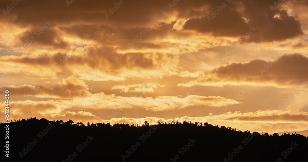 Cloudy sky at sunset during golden hour