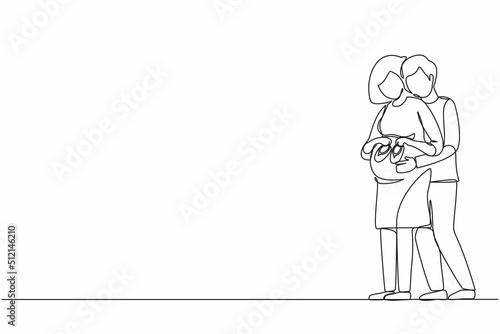 Continuous one line drawing cute pregnant woman and her husband holding baby shoes and hugging tummy. Pregnant woman holding baby shoes while husband touching her belly. Single line draw design vector