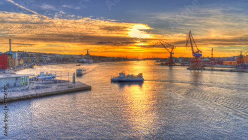 Tableau sur toile Focus on ferry driving towards the pier and station named Stenpiren in central Gothenburg, Sweden