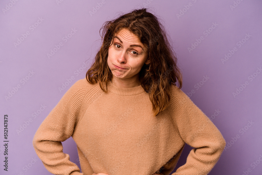 Young caucasian woman isolated on purple background confused, feels doubtful and unsure. Young caucasian woman isolated on purple background confused, feels doubtful and unsure.