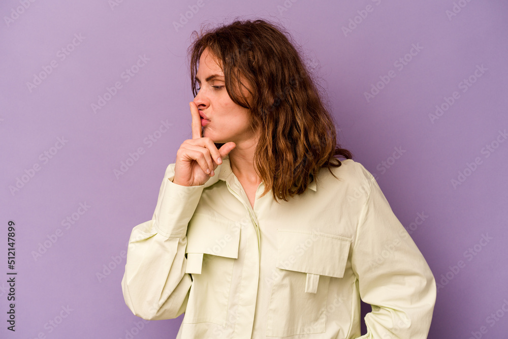 Young caucasian woman isolated on purple background keeping a secret or asking for silence. Young caucasian woman isolated on purple background keeping a secret or asking for silence.