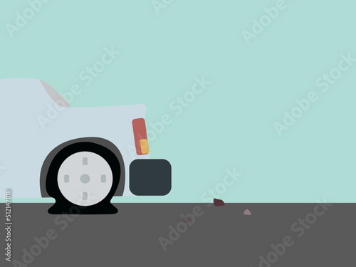 Car with flat tire parked on the roadside