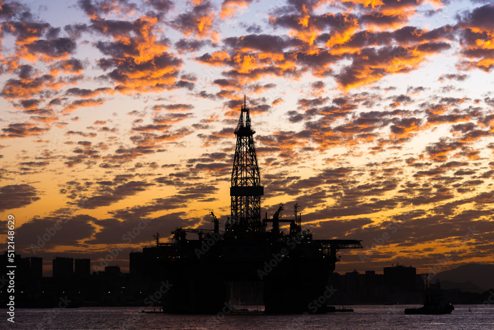 Silhouette of Oil Drilling Rig in Guanabara Bay in Rio de Janeiro, Brazil With Dramatic Sunset Sky Silhouette of Oil Drilling Rig in Guanabara Bay in Rio de Janeiro, Brazil With Dramatic Sunset Sky