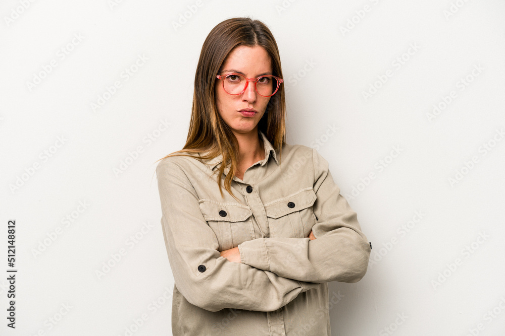 Young caucasian pregnant woman isolated on white background frowning face in displeasure, keeps arms folded. Young caucasian pregnant woman isolated on white background frowning face in displeasure, keeps arms folded.