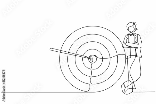 Continuous one line drawing businesswoman or manager standing next to target. Arrow hit target exactly. Successful business strategy, marketing concept. Single line design vector graphic illustration