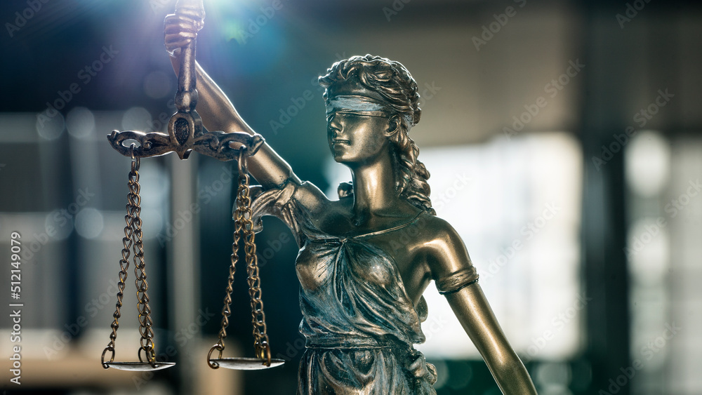 Statue of justice blindfolded lady holding scales and sword