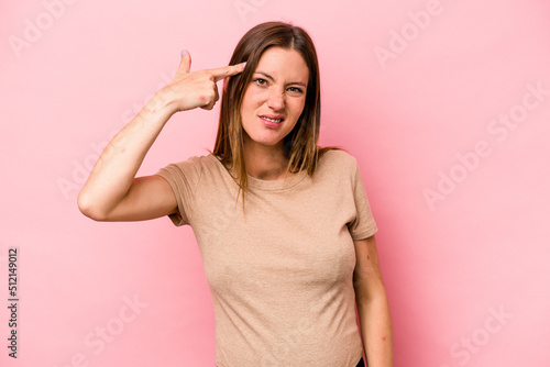 Young caucasian pregnant woman isolated on white background showing a disappointment gesture with forefinger.