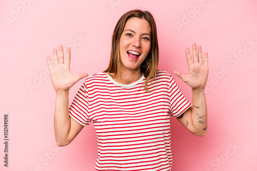 Young caucasian pregnant woman isolated on white background receiving a pleasant surprise, excited and raising hands.