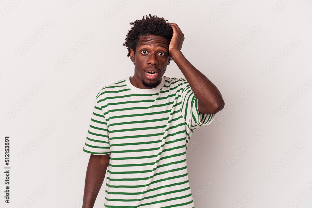 Young african american man isolated on white background being shocked, she has remembered important meeting. Young african american man isolated on white background being shocked, she has remembered important meeting.