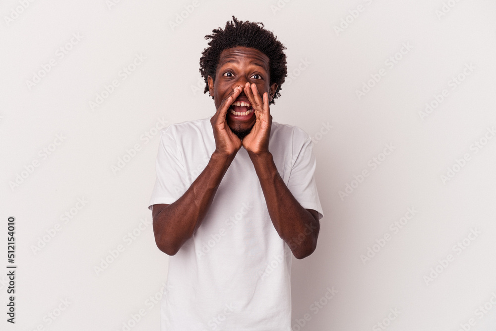 Young african american man isolated on white background saying a gossip, pointing to side reporting something. Young african american man isolated on white background saying a gossip, pointing to side reporting something.