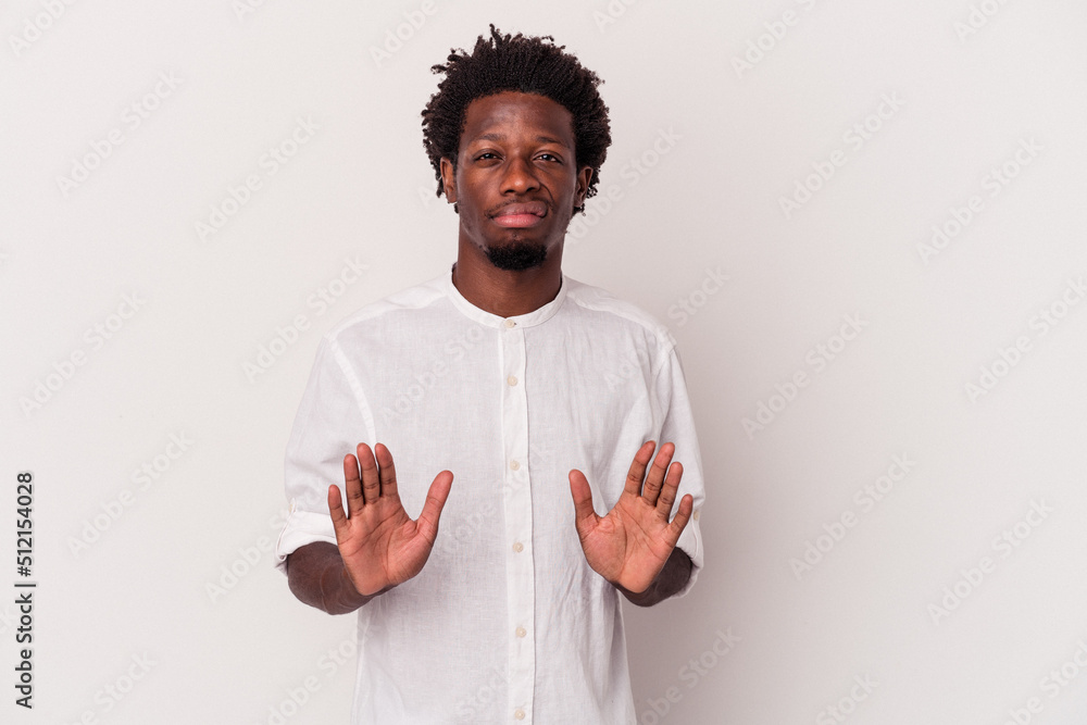 Young african american man isolated on white background rejecting someone showing a gesture of disgust. Young african american man isolated on white background rejecting someone showing a gesture of disgust.