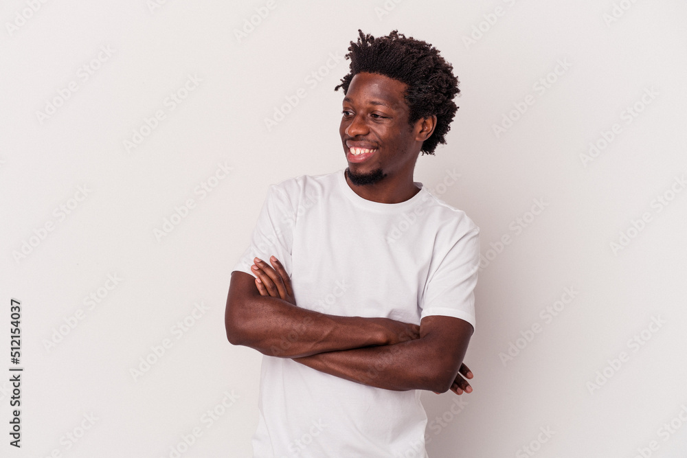 Young african american man isolated on white background smiling confident with crossed arms. Young african american man isolated on white background smiling confident with crossed arms.