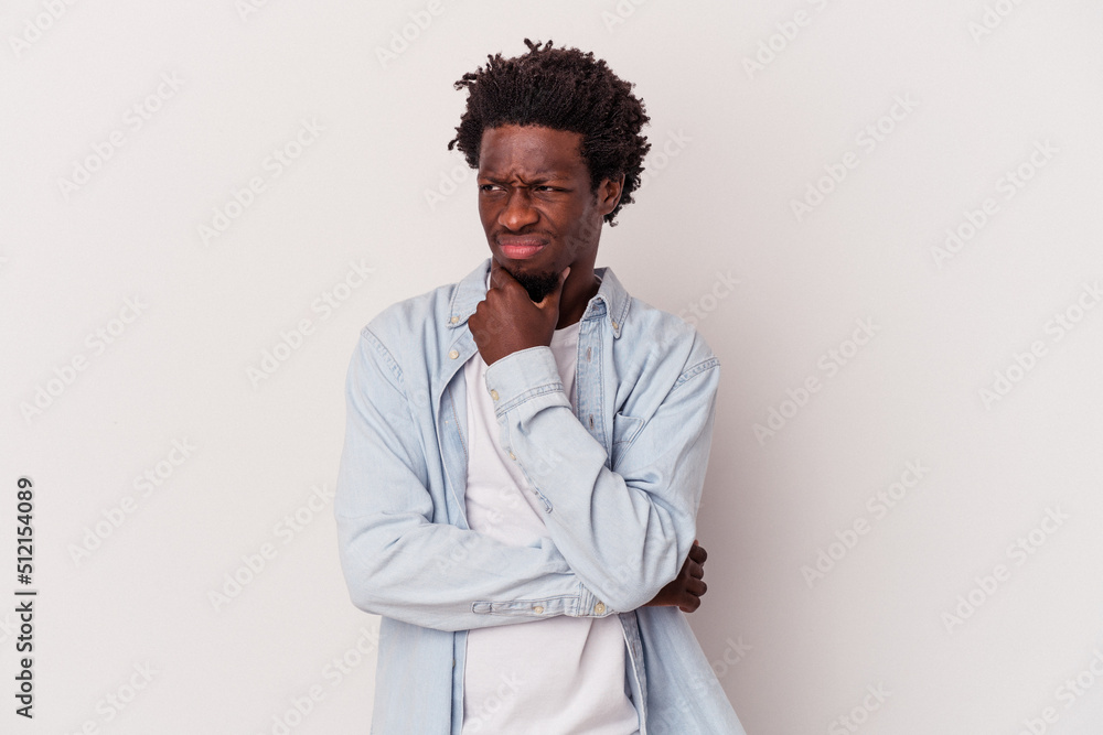 Young african american man isolated on white background suffers pain in throat due a virus or infection. Young african american man isolated on white background suffers pain in throat due a virus or infection.