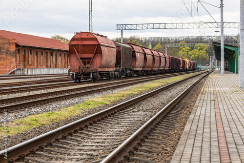 Cargo train platform with the container. Railroad depot