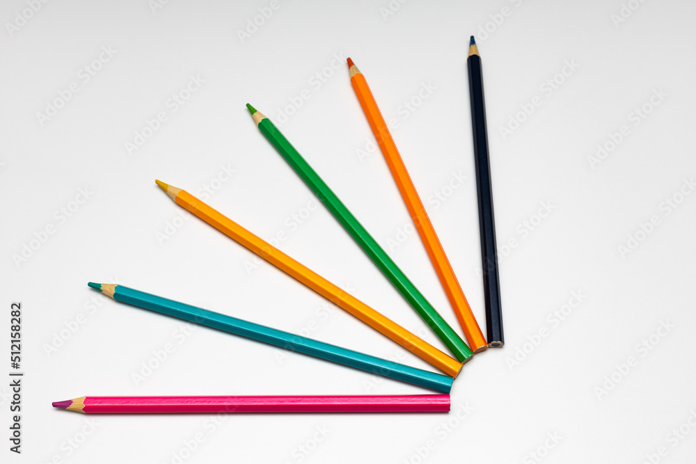 colored pencils lie on a white background colored pencils lie on a white background