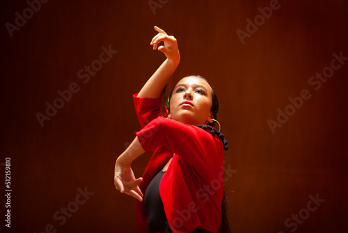 Bailarina de flamenco con torera roja photo