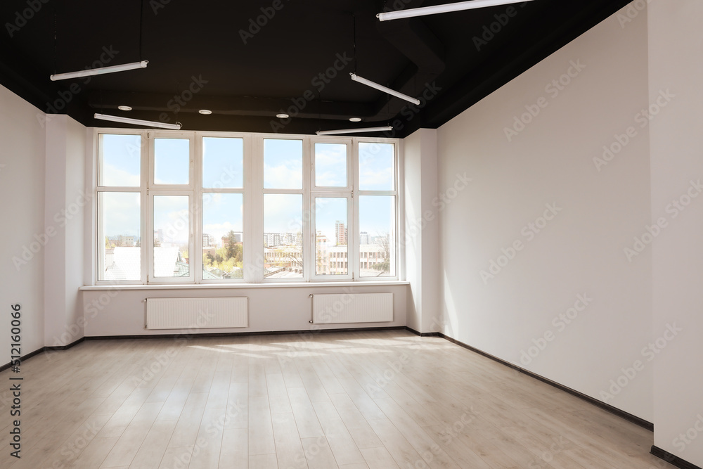 Fototapeta premium Modern office with window and radiators. Interior design