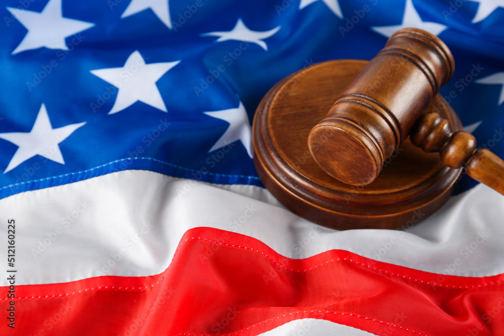 Judge's gavel on national American flag, closeup. Space for text