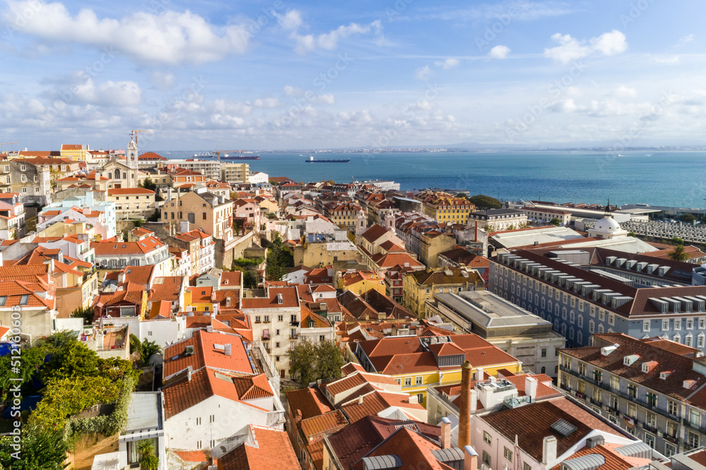 Aerial view of the skyline of Lisbon with beautiful old houses and the river in the background