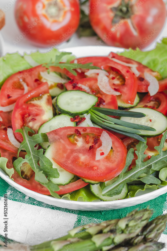 Fresh summer salad with cucumber, tomato, arugula, lettuce, onion for healthy dinner. Fresh summer salad with cucumber, tomato, arugula, lettuce, onion for healthy dinner.