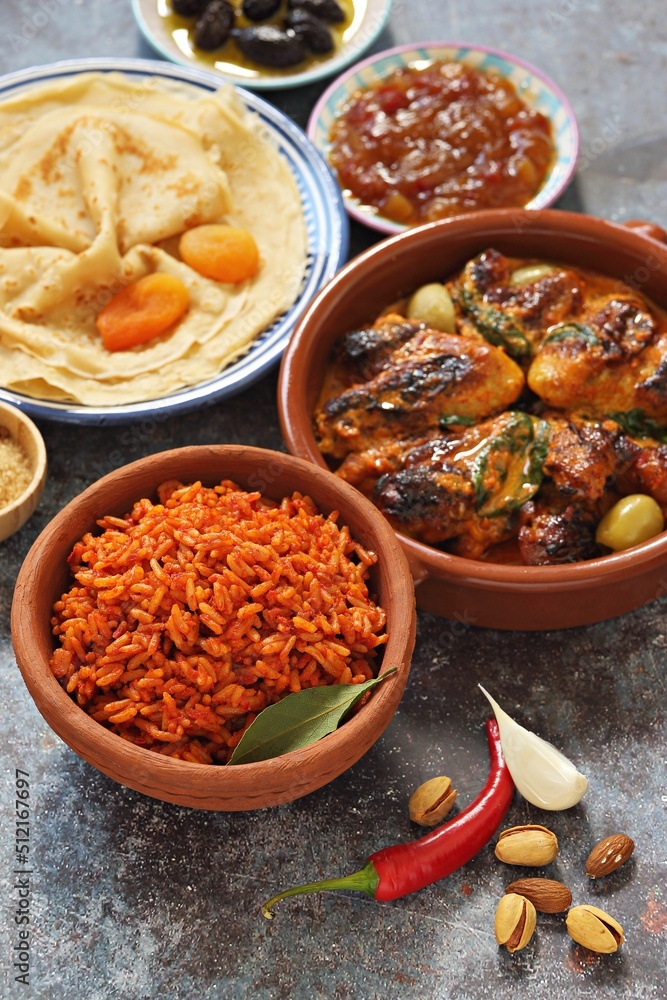 Fototapeta premium Jollof Rice. Pannekoek. Chicken Curry. Traditional African dishes. Flat layot
