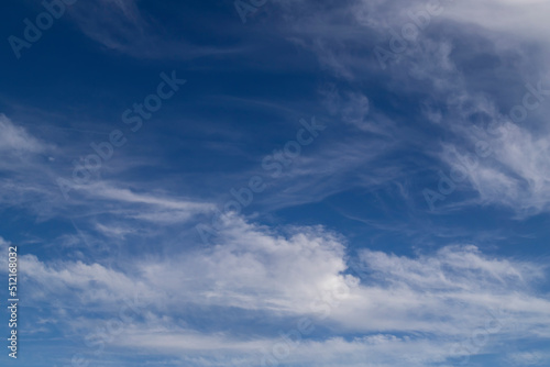 Blue sky cirrus clouds.